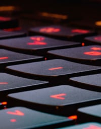 image of the top of a keyboard that has a red backlight